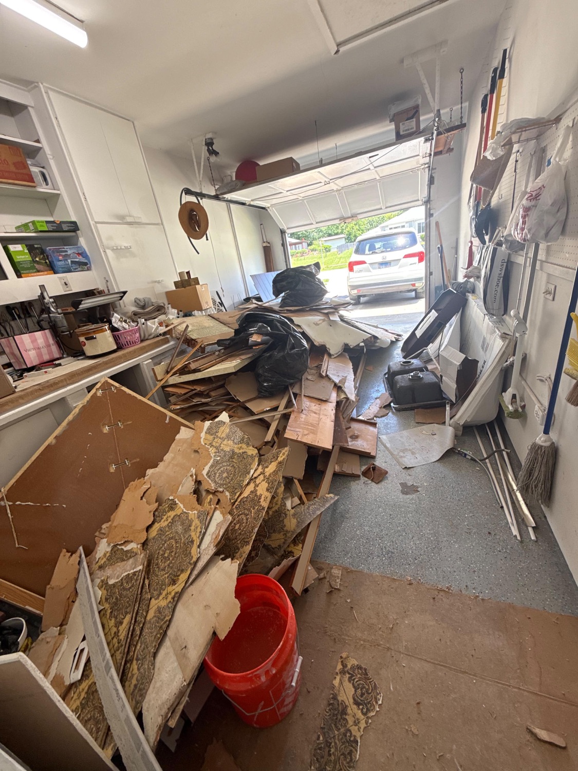 Garage packed with demolition debris before junk removal