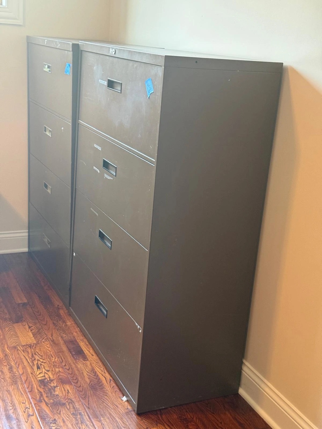 Heavy metal file cabinets cleared from an office