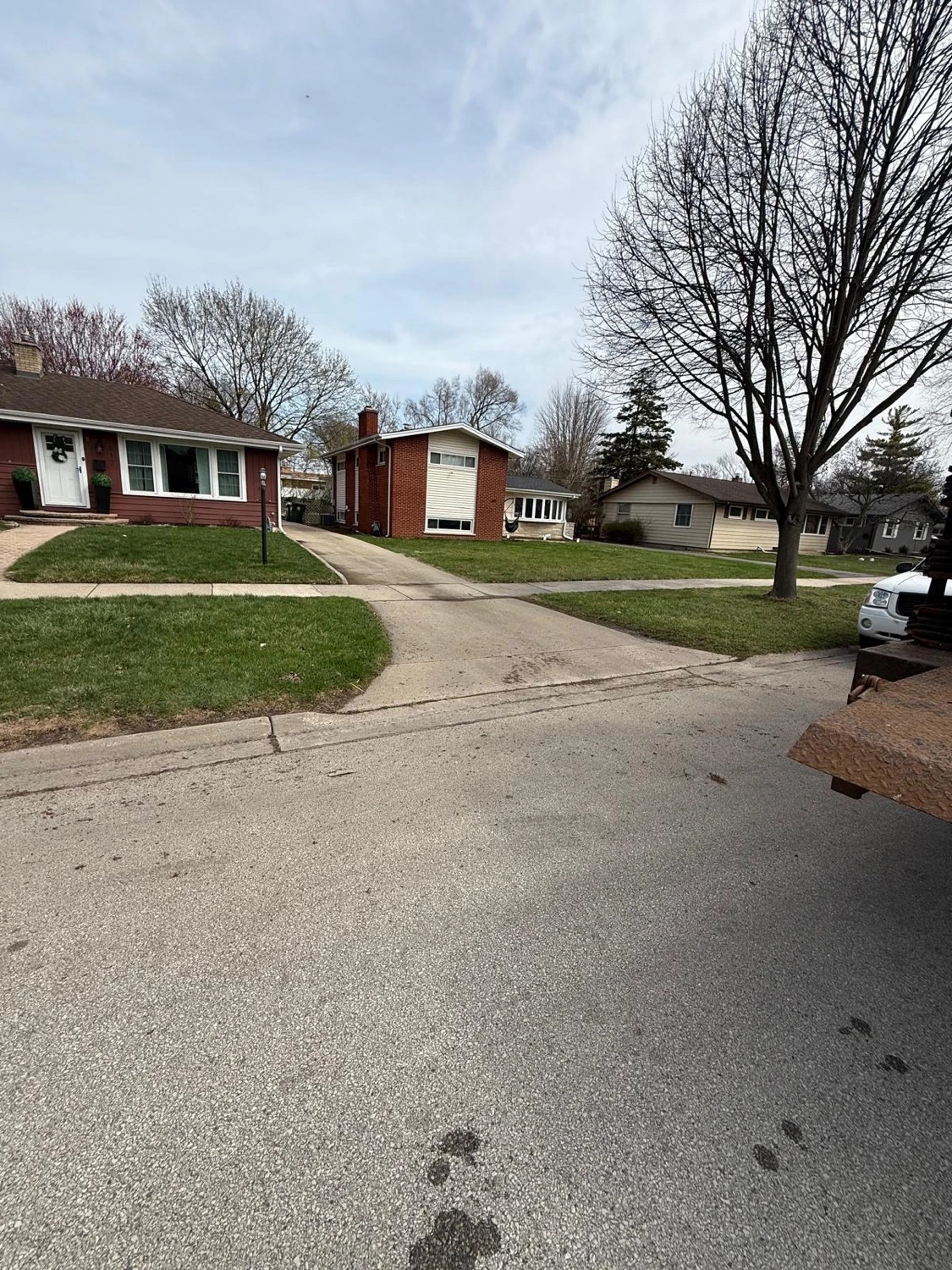 Driveway left clean after a curbside junk pickup