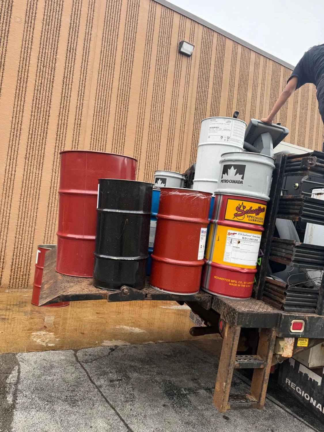 Truck loaded with scrap metal drums for recycling