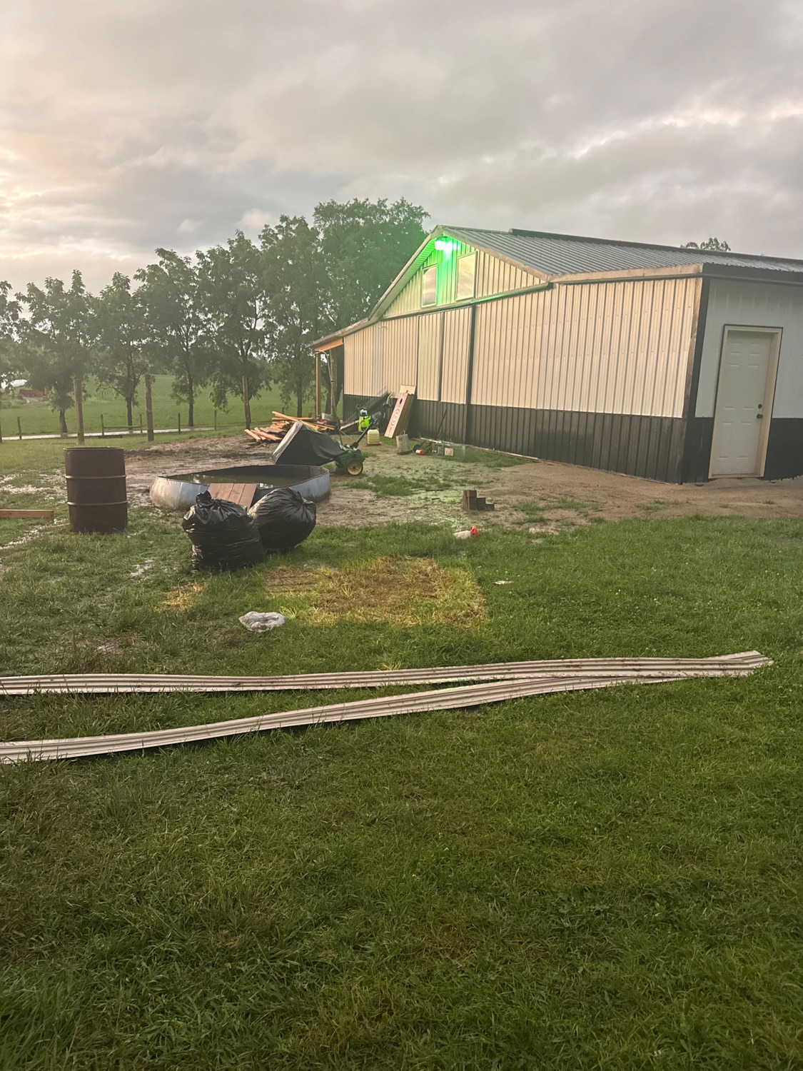 Rural barn property with scattered debris before a cleanout