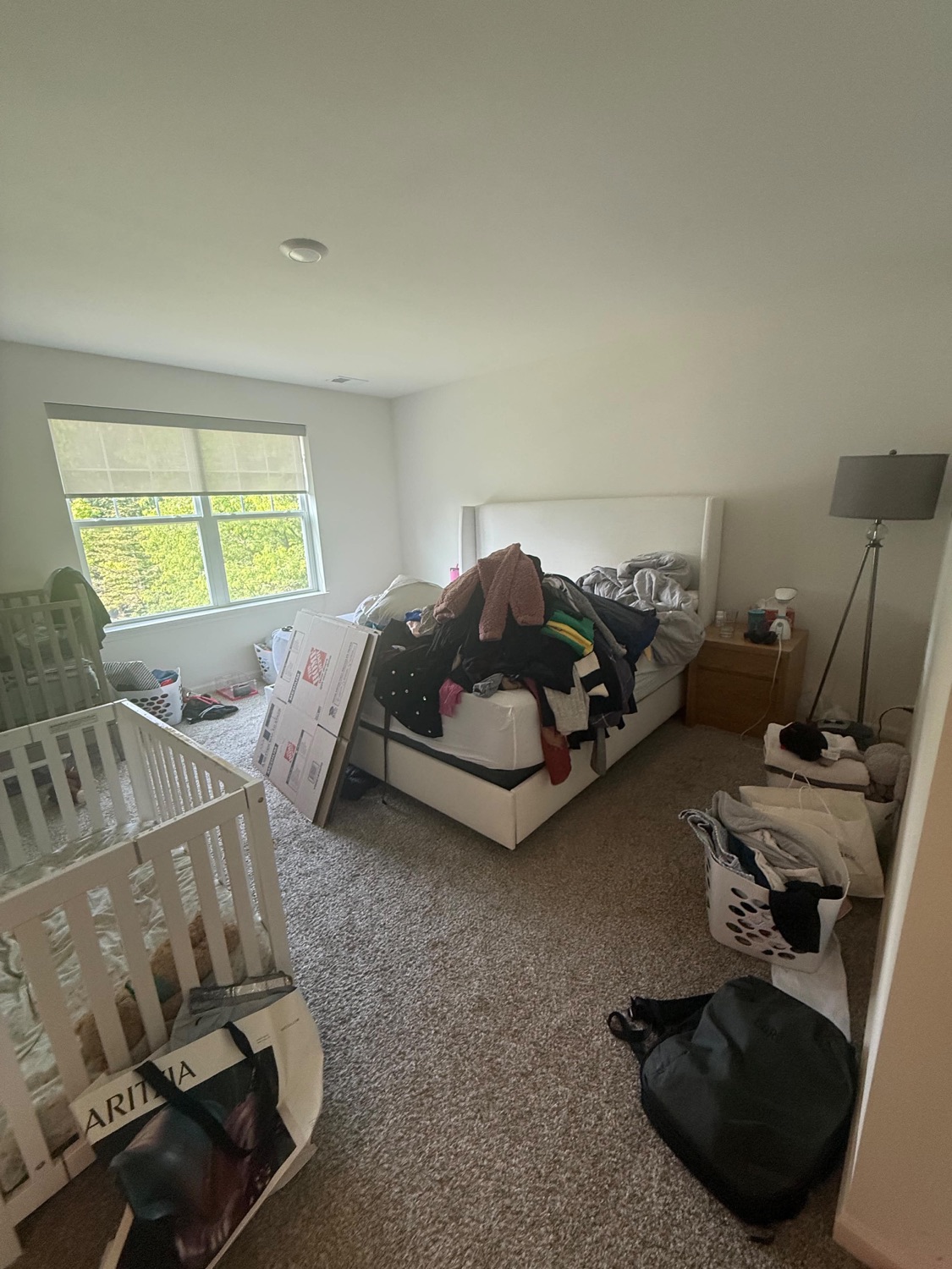 Bedroom full of clutter before an estate cleanout