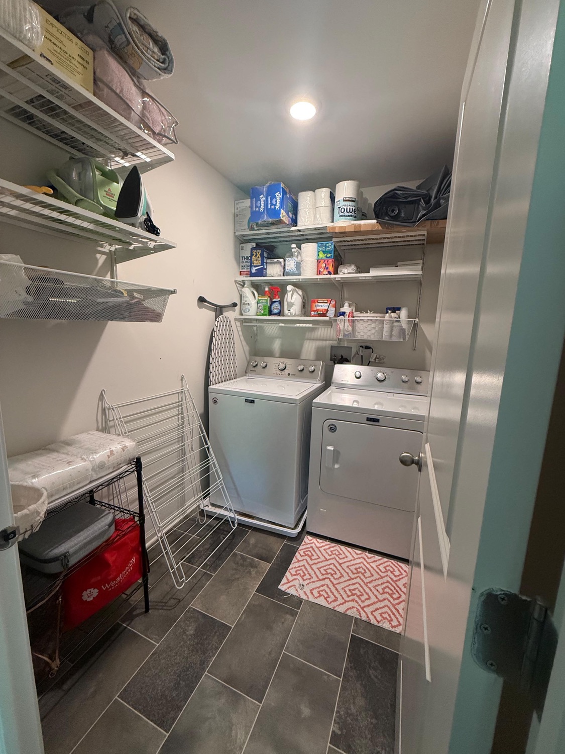 Organized, spotless laundry room after cleaning